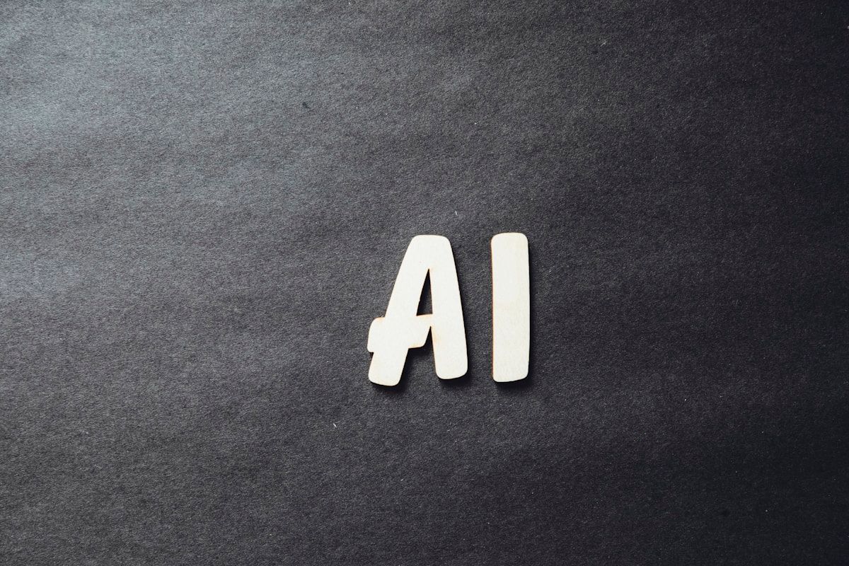 AI letters on dark surface — connecting artificial intelligence to meeting tools